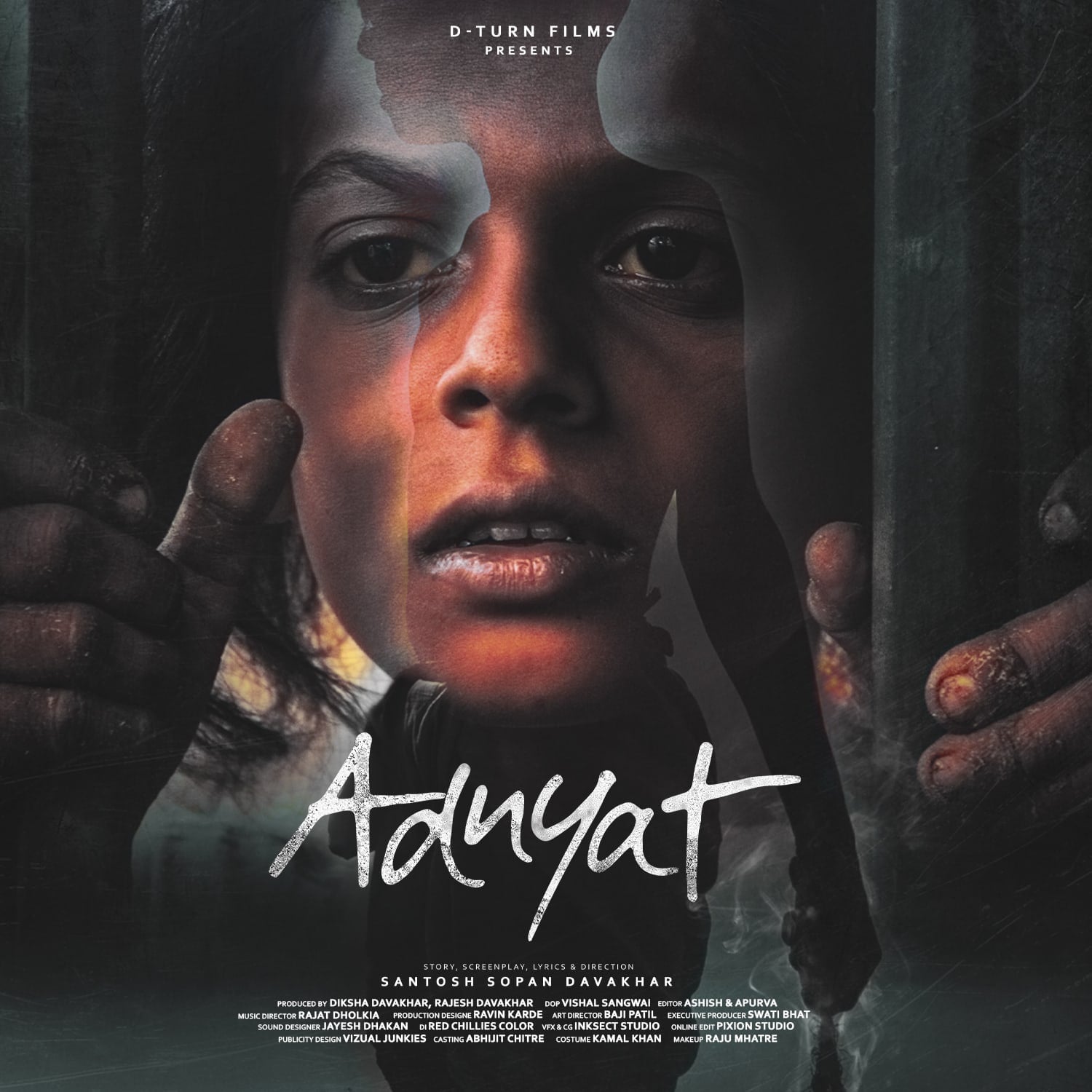 Adnyat poster: a child’s face seen through bars, dirt-streaked hands gripping them. Text: the title Adnyat; Story, screenplay, lyrics & direction: Santosh Sopan Davakhar; and the film’s credits.