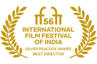 Laurel with the IFFI 56 logo: International Film Festival of India, Silver Peacock Award, Best Director.